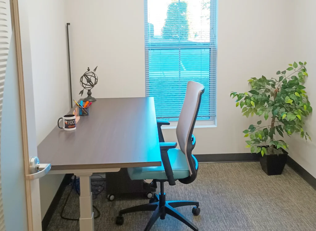 Office furnished with desk and professional chair available for half and full day rentals in Huntersville.